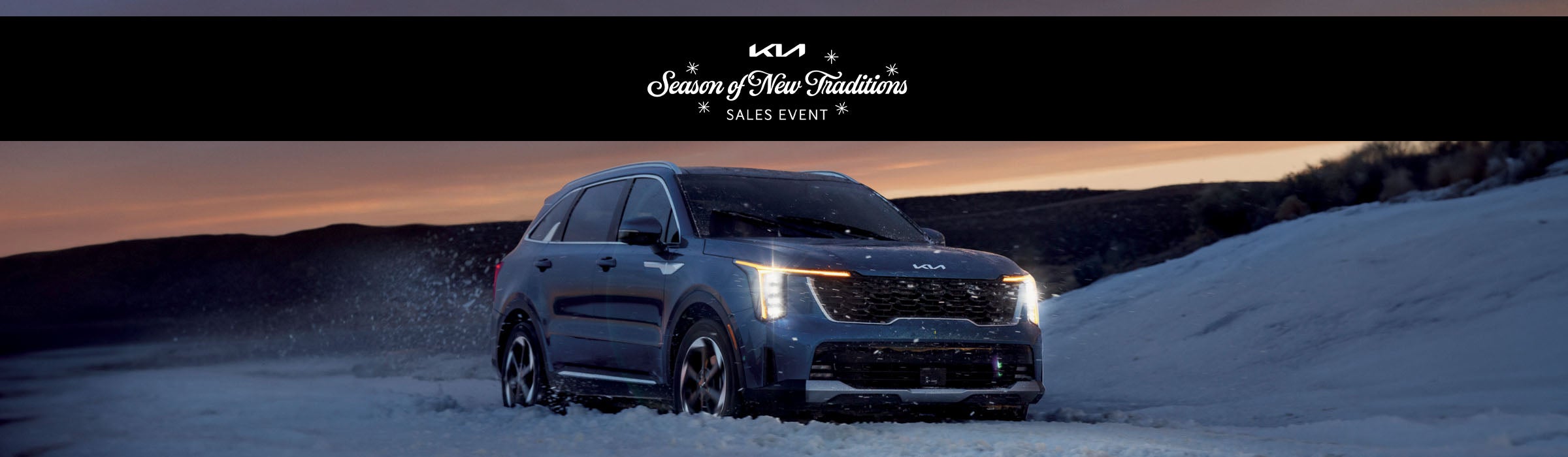 Kia Season of Giving Back Sales Event banner featuring multiple Kia models on display and winter holiday decorations